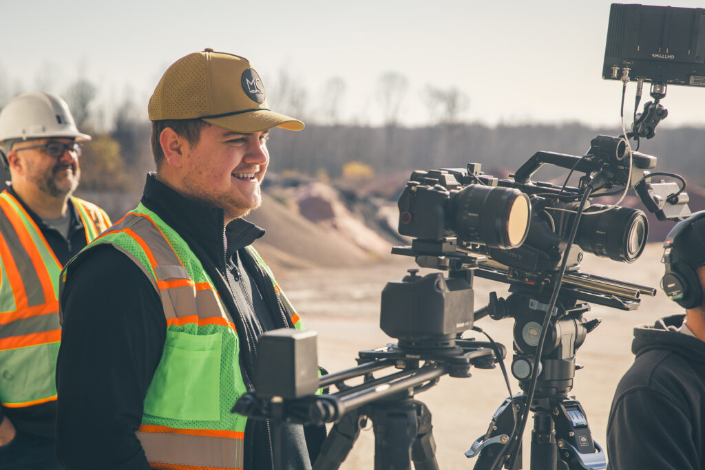 Picture of Media Core team member interviewing for a corporate video shoot